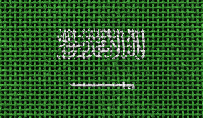 Saudi Arabia flag on the surface of a metal lattice. 3D image