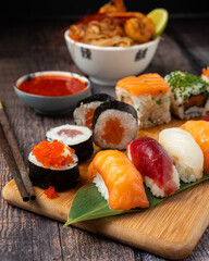 SUSHI COMBO WITH SAUCE AND YAKISOBA IN WOOD