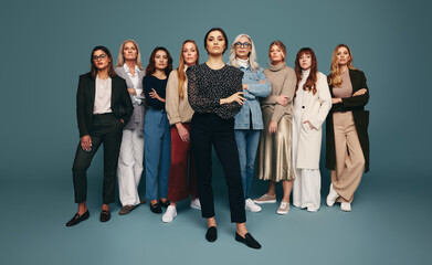 Woman standing with a group of strong and empowered women