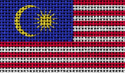 Malaysia flag on the surface of a metal lattice. 3D image