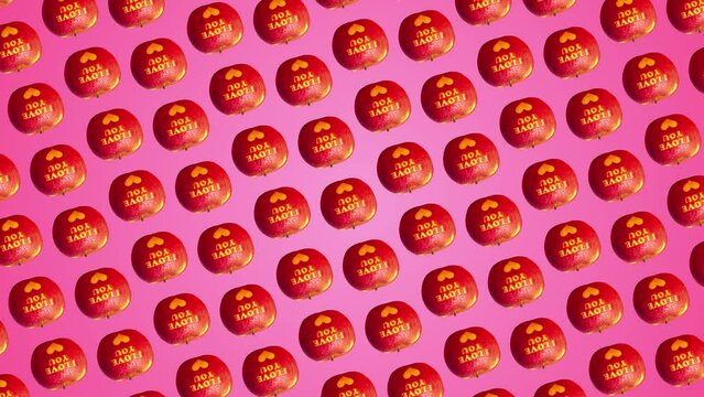 Professional 4K animated pattern with many red Apples with an inscription I love you move and rotates on trending pink color gradient backgroundnd, top view. 3 in 1 different sides and size animations