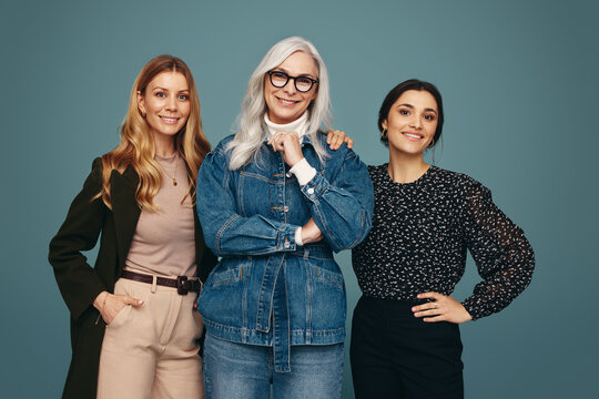 Three generation women standing together in a studio