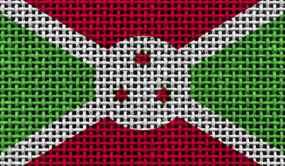 Burundi flag on the surface of a metal lattice. 3D image