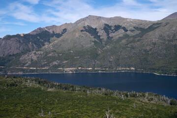 Fototapeta premium View of the forest, blue water Gutierrez lake and Catedral hill in Bariloche, Patagonia Argentina.
