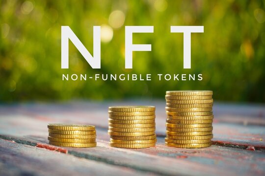 NFT or non-fungible tokens concept. Coins staked background.