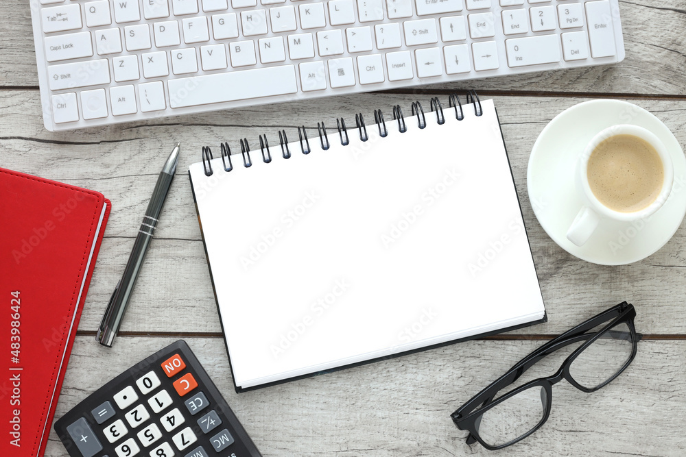 Poster empty open notepad on wood table, flat lay photo of office desk with keyboard cup of coffee and calc