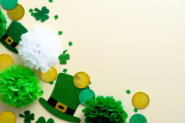 St Patricks Day background with shamrock clovers, leprechauns hats, gold coins, decorations. Flat...