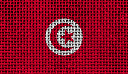 Tunisia flag on the surface of a metal lattice. 3D image