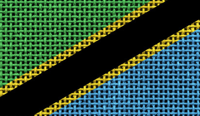 Tanzania flag on the surface of a metal lattice. 3D image