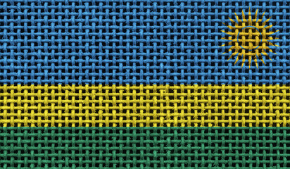 Rwanda flag on the surface of a metal lattice. 3D image