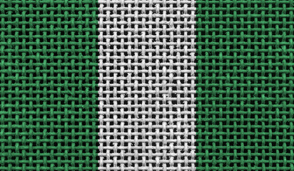 Nigeria flag on the surface of a metal lattice. 3D image