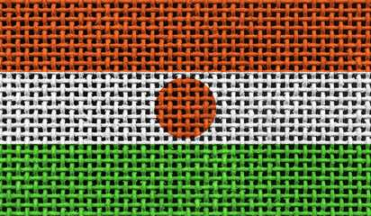 Niger flag on the surface of a metal lattice. 3D image