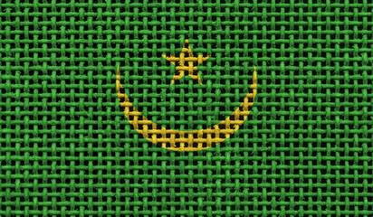  Mauritania flag on the surface of a metal lattice. 3D image