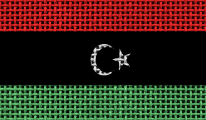 Libya flag on the surface of a metal lattice. 3D image
