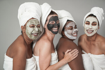 Multiracial women having fun doing beauty treatment