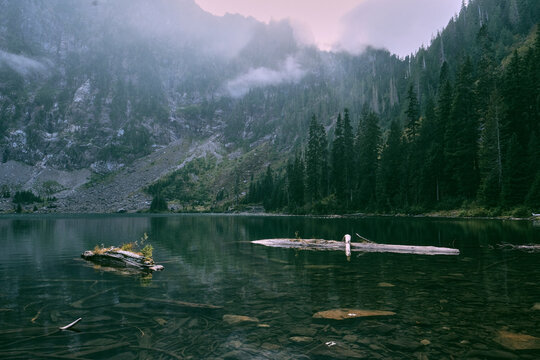 Lake 22 with low clouds rising into the mountains.