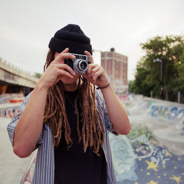 Teenage skateboard athlete with dreads