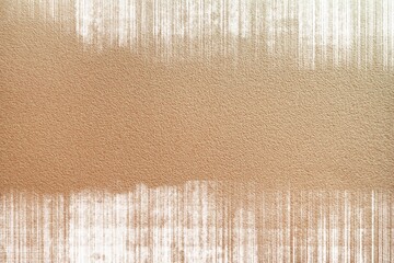 Grunge shabby background with stripes of dry white paint on brown craft paper. Texture with brush strokes.