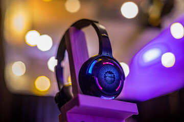 Colorful Silent Disco Headphone with lights shining behind it at an event