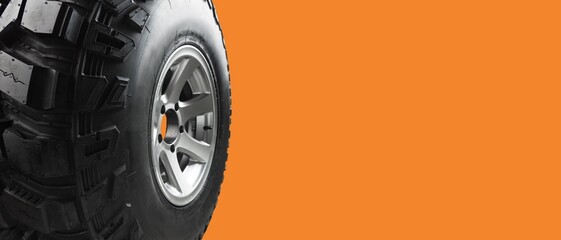 Winter car tires. Group of black tires for winter driving on a cpolored background.