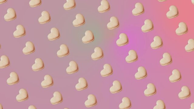 Interesting heartbeat pulse  animation pattern with vanilla French Macaroons cookies in heart shape on a trending ligh pink-purpule multi colored gradient background.Romantic Love concept for St. Val