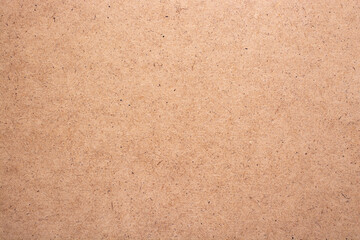 Abstract background of fiberboard close-up.