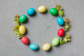 round frame Multi colors Easter eggs on colored background . Pastel color Easter eggs holiday concept with empty space for you design