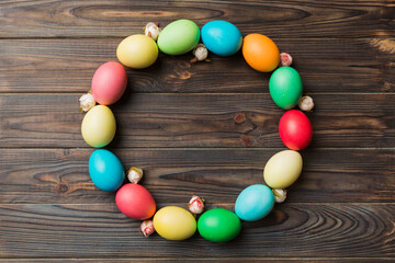 round frame Multi colors Easter eggs on colored background . Pastel color Easter eggs holiday concept with empty space for you design