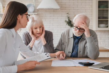 Emotional mental support. Financial adviser consulting senior elderly grandparents couple showing...