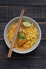 Khao Soi Recipe,Khao Soi,Khao Soi Kai, Thai Noodles Khao Soi, Chicken Curry with seasoning served on wooden table
