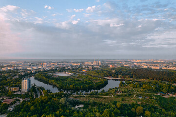 Fototapeta na wymiar Aerial photography of a city park with a river