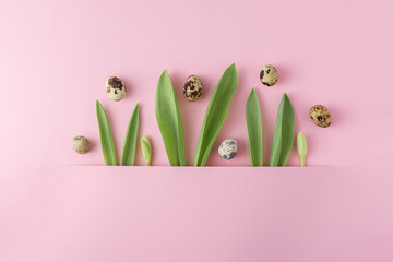 Creative Easter mockup with bunny ears and eggs on a pink background.