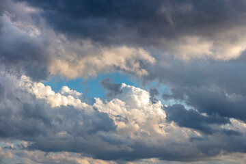 Cloud on blue sky background. Cloudscape grey and orange shade. Twilight light color the cloudy sky