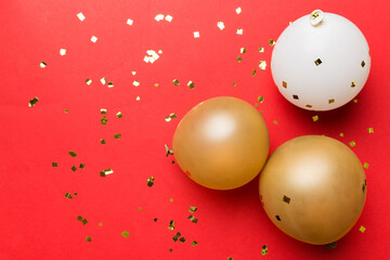 Background with fastive air balloons of round shape and confetti, multicoloured top view. Birthday...