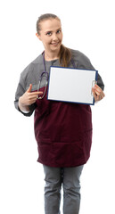 Doctor, medic holds a tablet with sheets of paper and points a finger at it. Pretty woman smiles and looks at us. place for an inscription. isolated white background