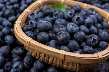 Fresh blueberries in a wooden bowl. Blueberry Antioxidant. Healthy and nutrition concept