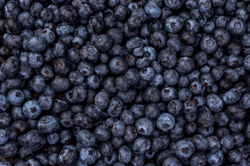 Fototapeta na wymiar Juicy and fresh blueberries on a rustic table., top view. Blueberry Antioxidant. Healthy and nutrition concept