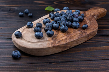 Juicy and fresh blueberries on a rustic table. Blueberry Antioxidant. Healthy and nutrition concept