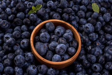 Fresh blueberries in a wooden bowl. Blueberry Antioxidant. Healthy and nutrition concept