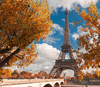 Autumn view to Eiffel Tower in Paris, with amazing colours and blue sky. Travel in France.