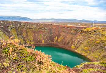 Fototapeta na wymiar Volcanic crater Kerid with blue lake inside, Iceland tourist attraction