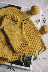 Hand knitting with needles and yarn balls.  Concept for handmade and hygge slow life.