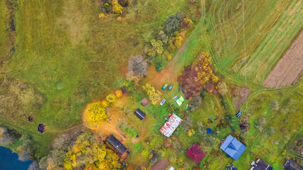 Aerial view kayaks for rent in countryside. Group of canoes rental kayak in the rental point. Kayaking adventure.