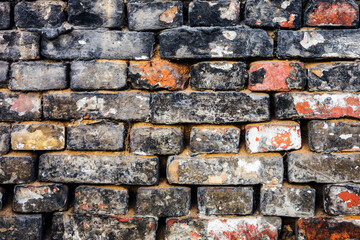 Brick wall of old faded bricks as a background. Grunge texture. Loft style.	