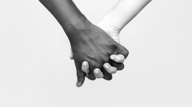 Black and white hand Love Partnership. Black, White Woman and man Holding Hands Together. White Woman, African man Holding Hand Friendship Symbol. African Peace Symbol. Mixed race couple holding hand