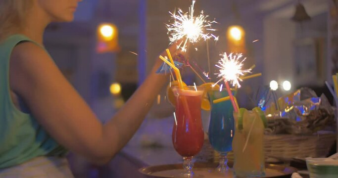 Serving Cocktail Glasses with Sparklers in Them