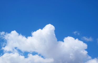 Naklejka na ściany i meble Fluffy Pure White Cumulus Clouds Floating on Vivid Blue Sky