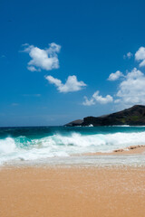 beach with sky and clouds and rocks in Hawaii