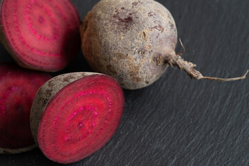 beetroot on a black background, close up of healthy vegetables, copy space