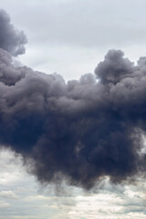 dangerous cloud of black smoke close up as background